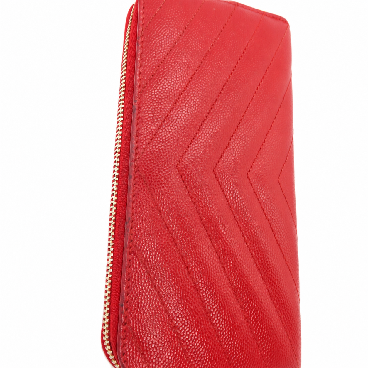 Saint Laurent YSL Red Chevron Grain de Poudre Zip Around Wallet Gold Logo  pebbled leather zip-around wallet with a chevron quilted pattern and a gold-tone zipper, shown against a plain white background.