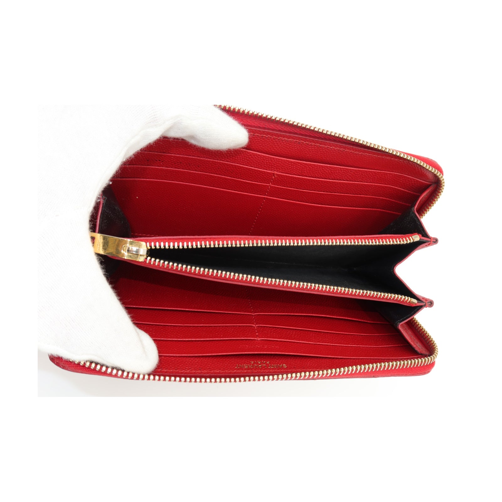 Saint Laurent YSL Red Chevron Grain de Poudre Zip Around Wallet Gold open wallet with gold-tone zippers and a black interior, shown against a plain white background.