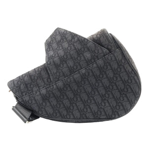 A black Dior monogram shoulder bag with a curved silhouette, displayed on a clean white background.