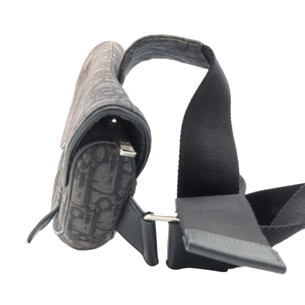 A Dior monogrammed shoulder bag in dark gray and black, featuring a black strap and silver-tone hardware, photographed on a clean white background.