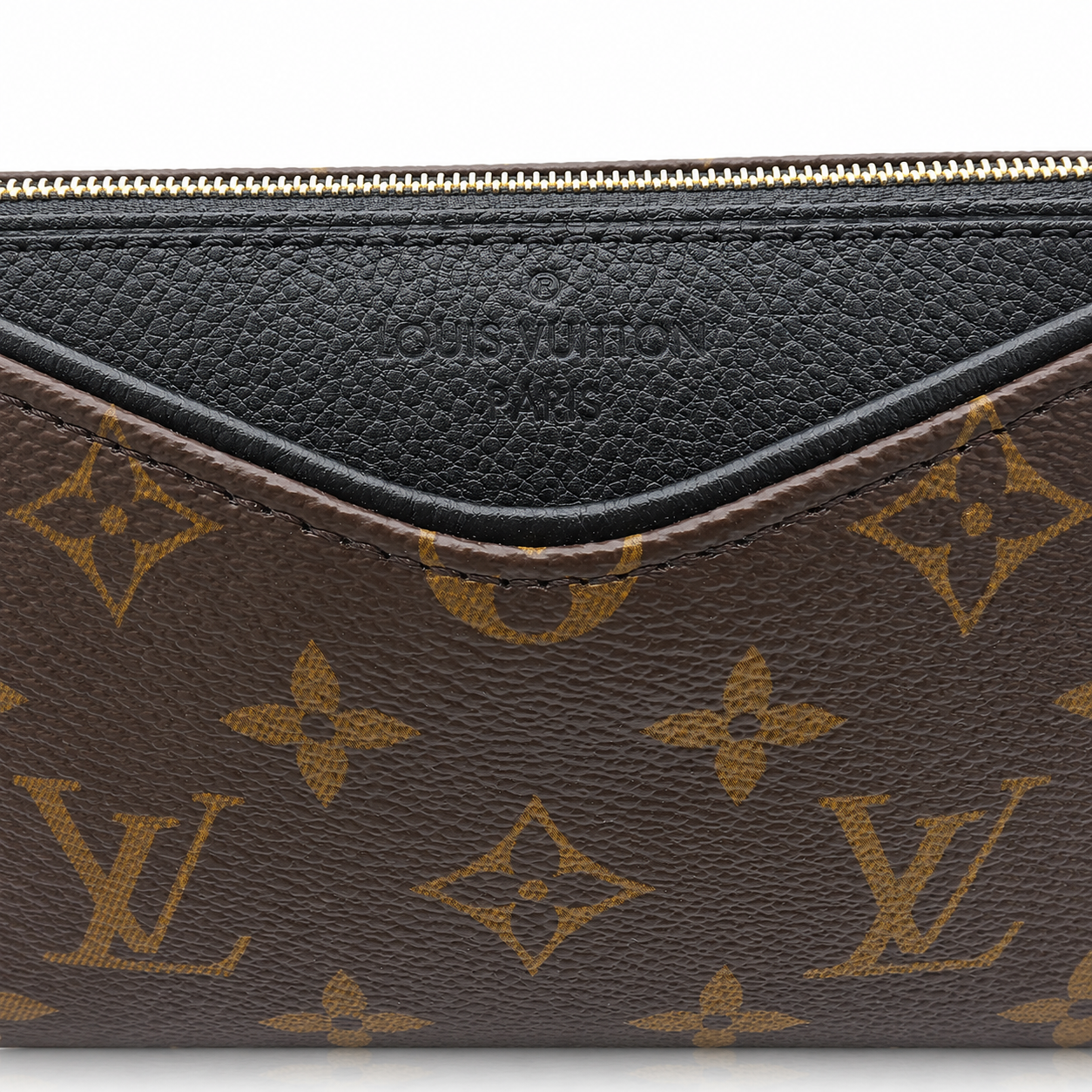 Close-up of a Louis Vuitton monogram pouch or clutch showing the brown coated canvas with gold-tone LV monogram pattern and a black leather trim along the top zipper.