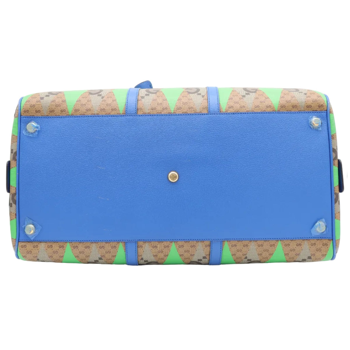 A Gucci duffle bag shown from the bottom, featuring a vibrant blue base with brown and green monogram patterned trim.