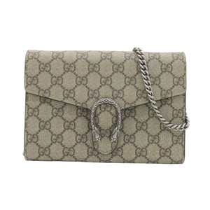 A Gucci Dionysus flap shoulder bag in beige GG Supreme canvas with a silver-tone horsebit clasp and chain strap, shown on a plain white background.