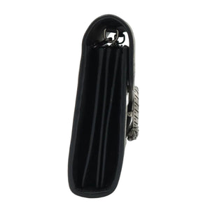 A black leather clutch bag with a silver-tone metal clasp, standing upright on a clear display stand against a white background.