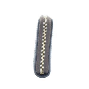 Black and silver tool with a long arm on a white background
