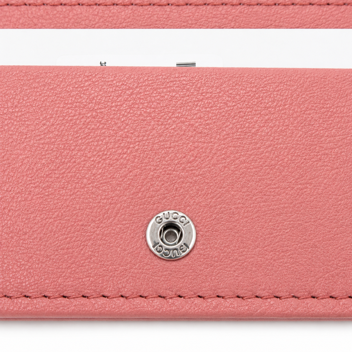 Gucci Pink Leather Card Holder Wallet with Interlocking GG Logo & Snap Closure – a close-up of a pink textured leather