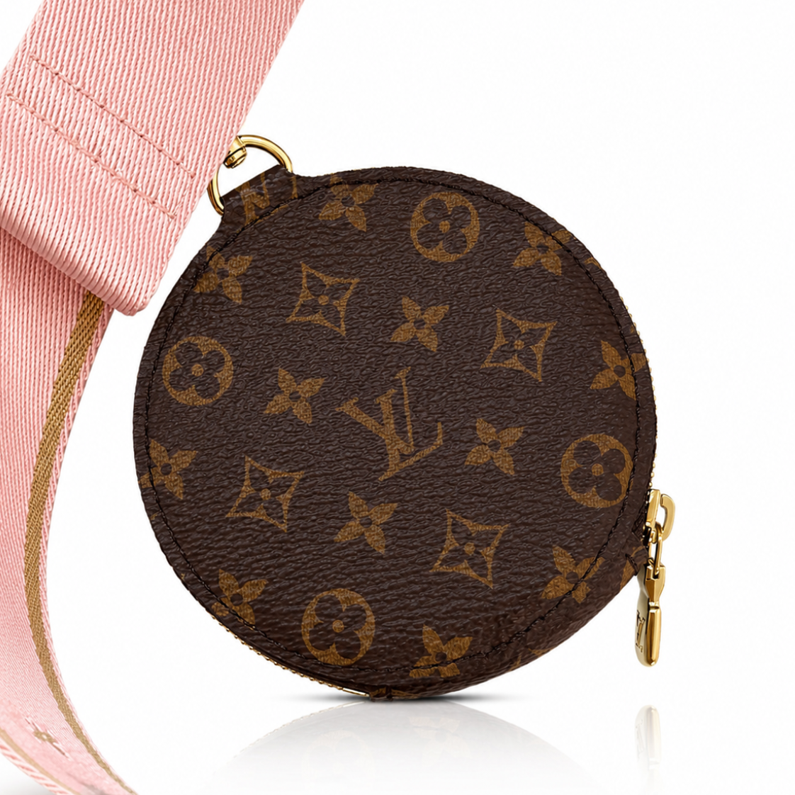 Close-up of Louis Vuitton Multi Pochette Accessoires round coin purse in brown Monogram canvas attached to the pink jacquard strap
